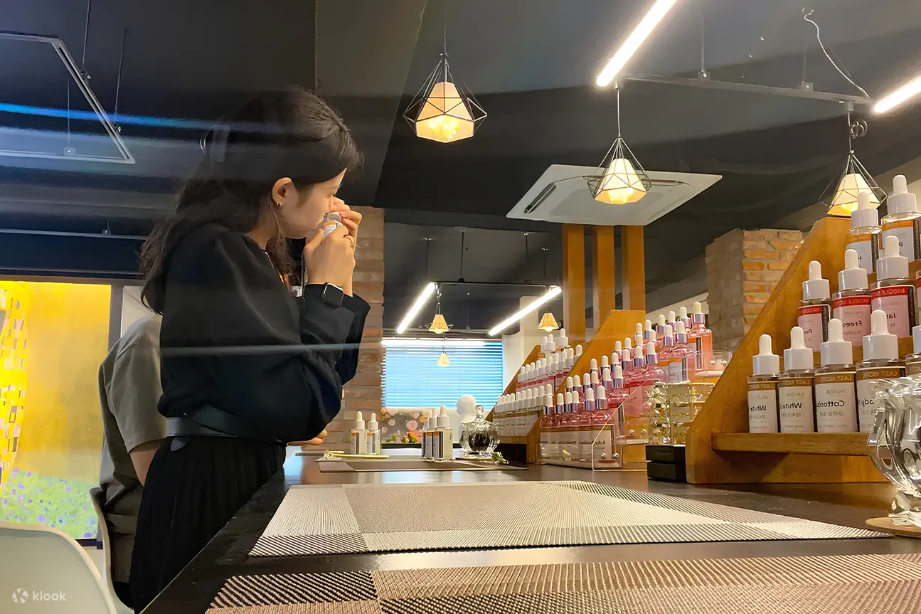 Customer smelling a perfume ingredient