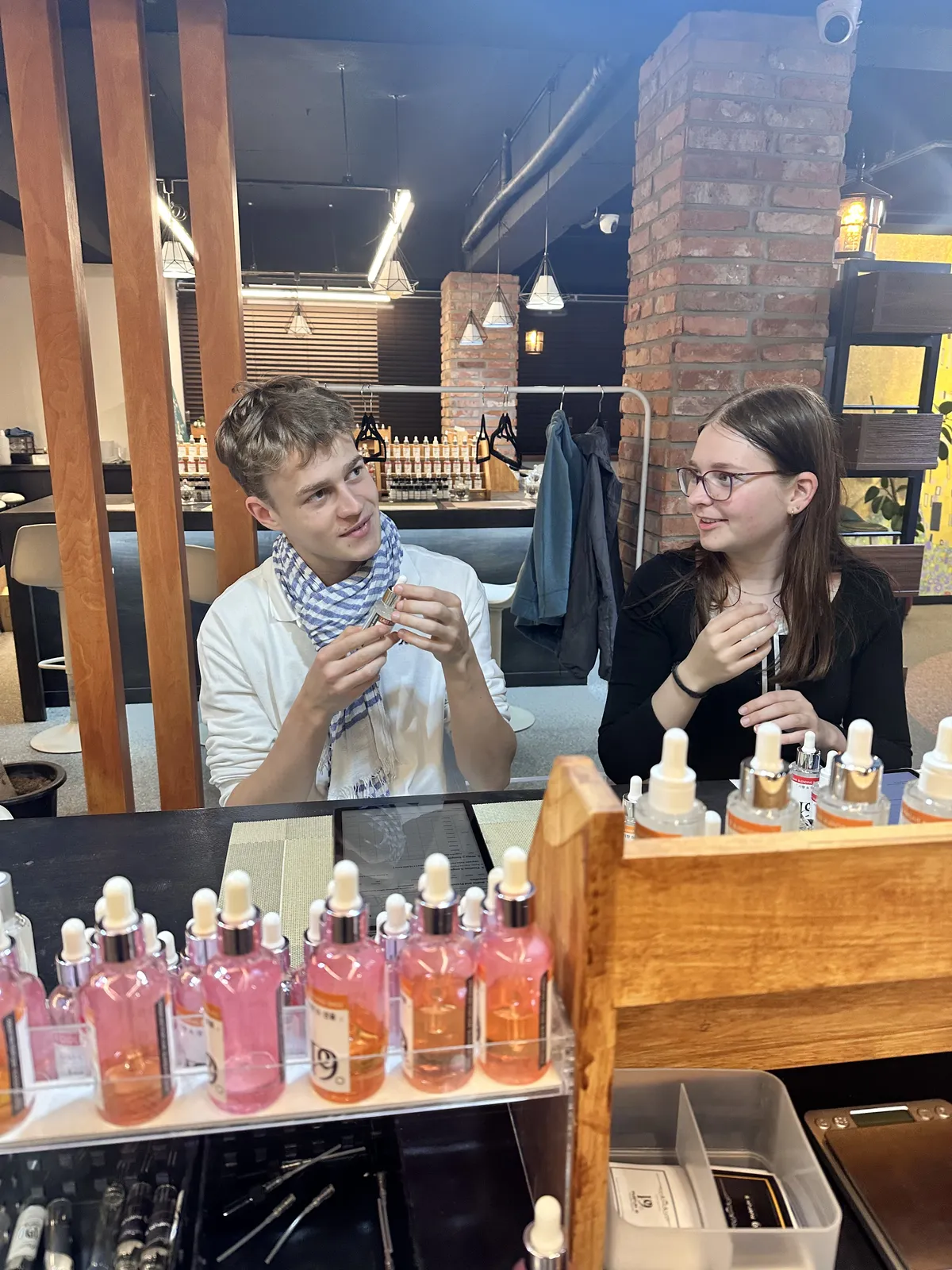 Couple comparing fragrance preferences at a Hongdae perfume workshop