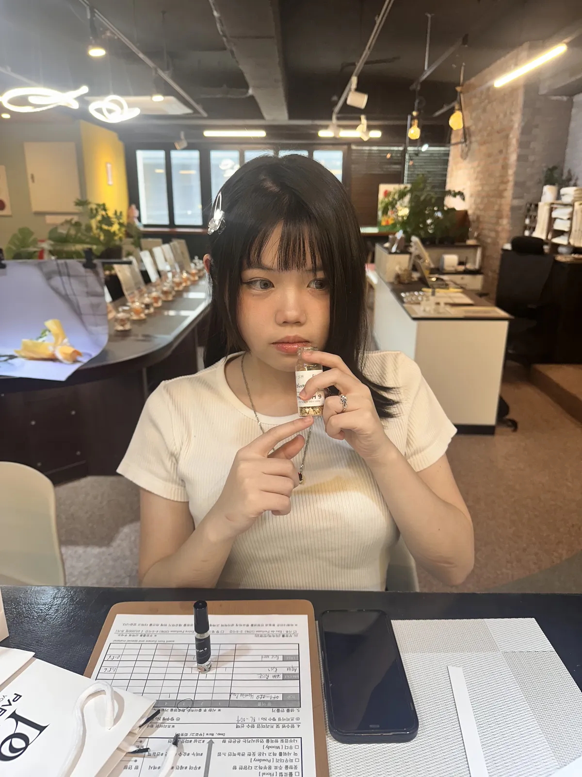 Customer smelling a fragrance ingredient at Parfum9 in Hongdae