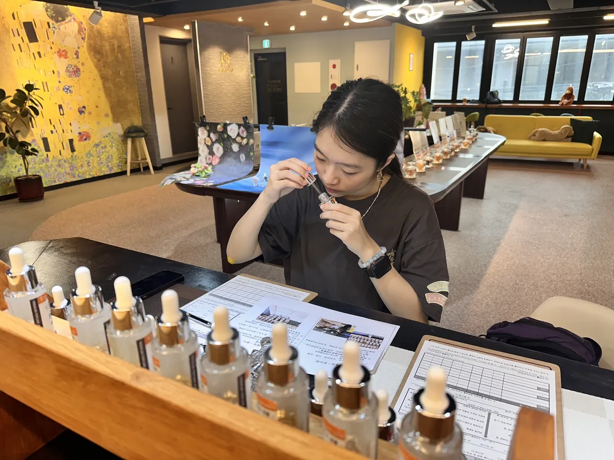 Customer exploring fragrance notes at the perfume workshop